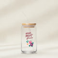 Clear glass jar with straw and wooden lid, featuring 'Mom, Best Grower' text and floral design on a white background.