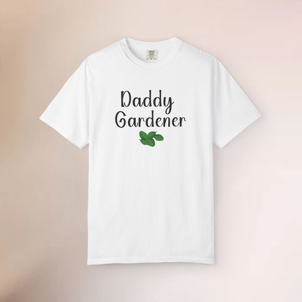 White t-shirt with 'Daddy Gardener' text and a leaf graphic on a beige background