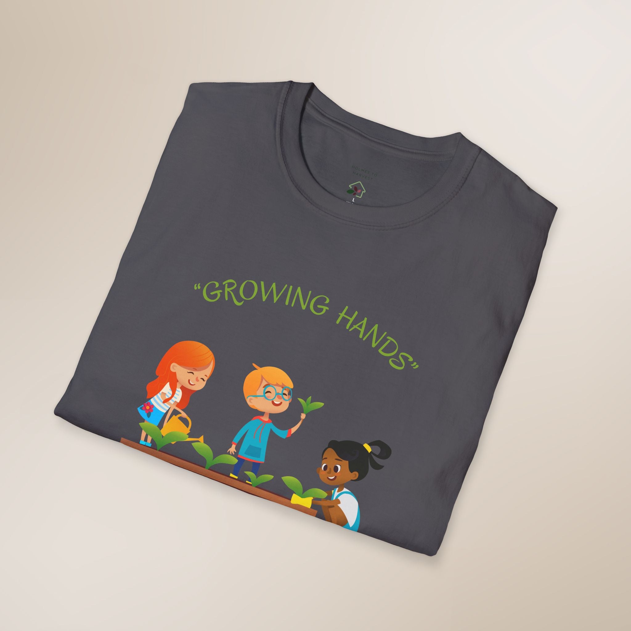Folded t-shirt with 'Growing Hands' design on a light beige background