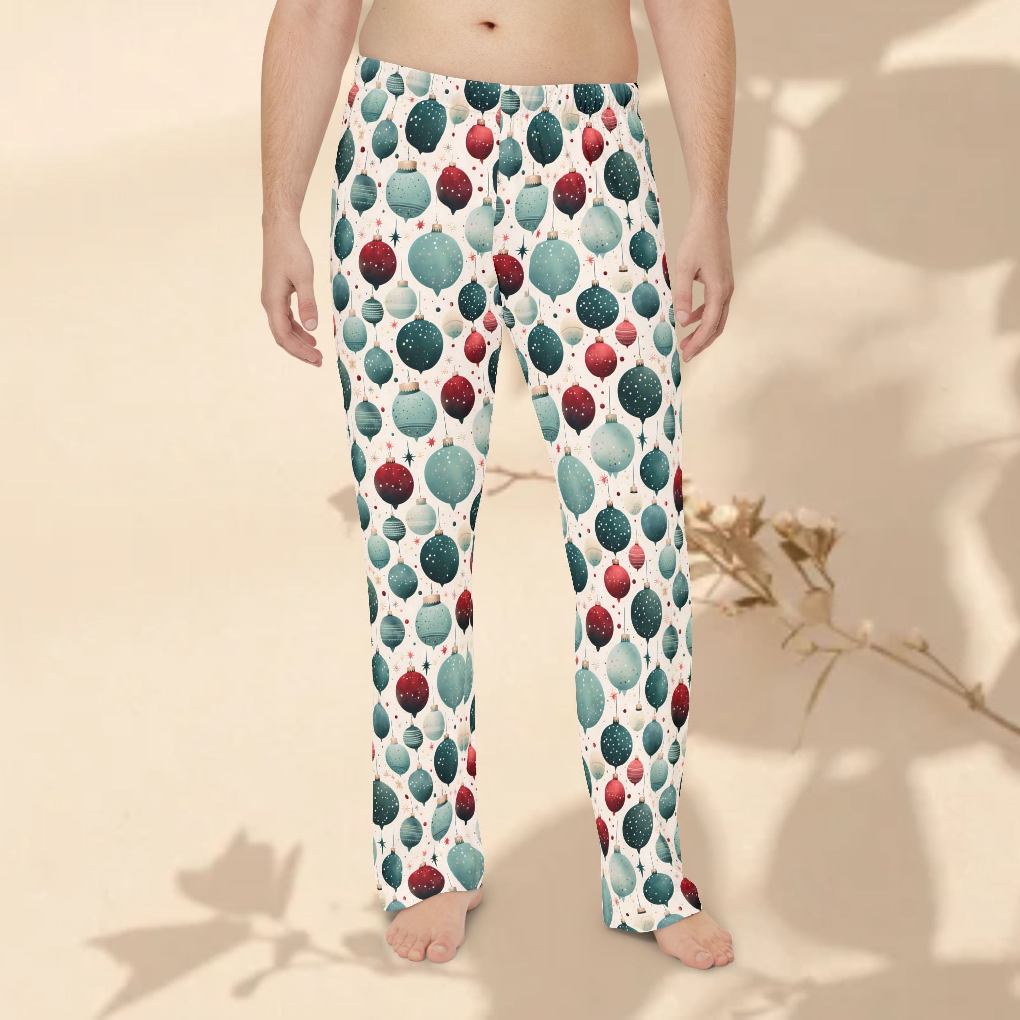 Pajama pants with a colorful ball pattern worn by a person on a neutral background
