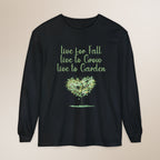 Black long-sleeve shirt with green text and tree graphic on a beige background