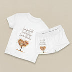 White t-shirt with autumn-themed design and text on a white background