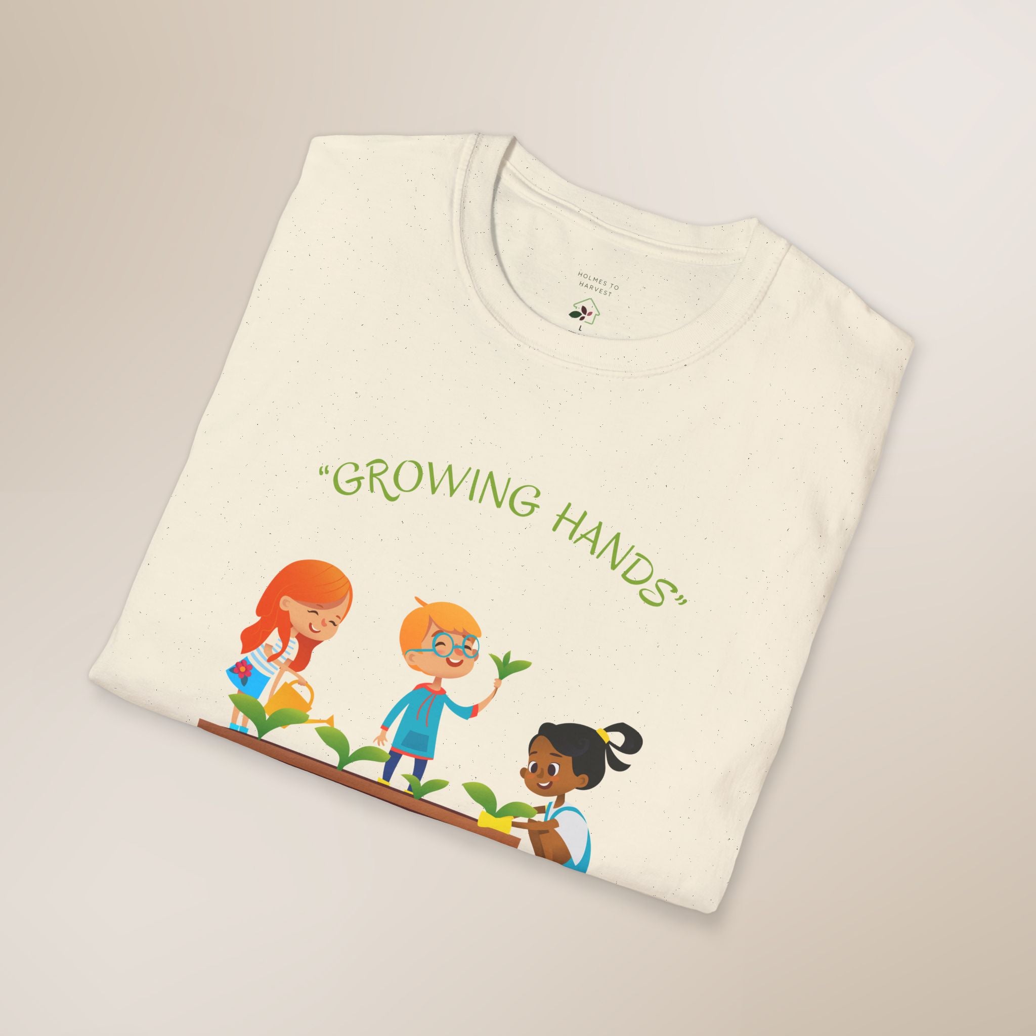Folded t-shirt with 'Growing Hands' graphic and text on a light background