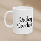 White mug with 'Daddy Gardener' text on a beige background