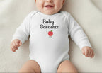 White baby onesie with 'Baby Gardener' text and an apple graphic on a white background