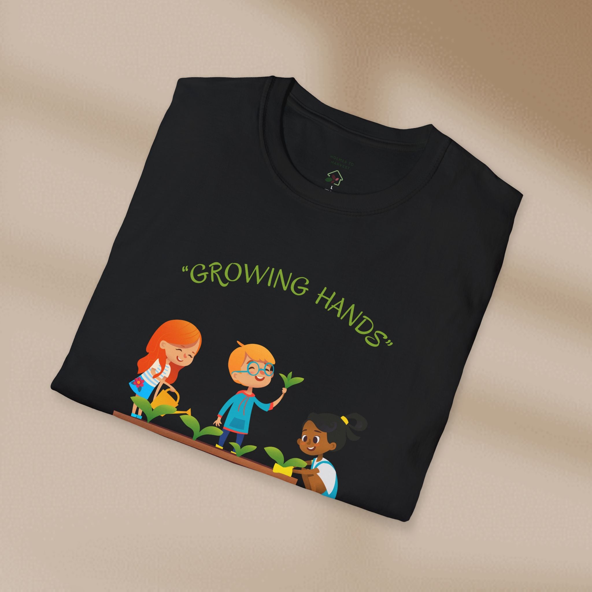 Black t-shirt with 'Growing Hands' design on a beige background