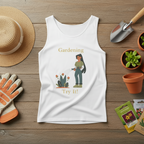 White tank top with gardening graphic, gardening tools, and plants on a wooden surface