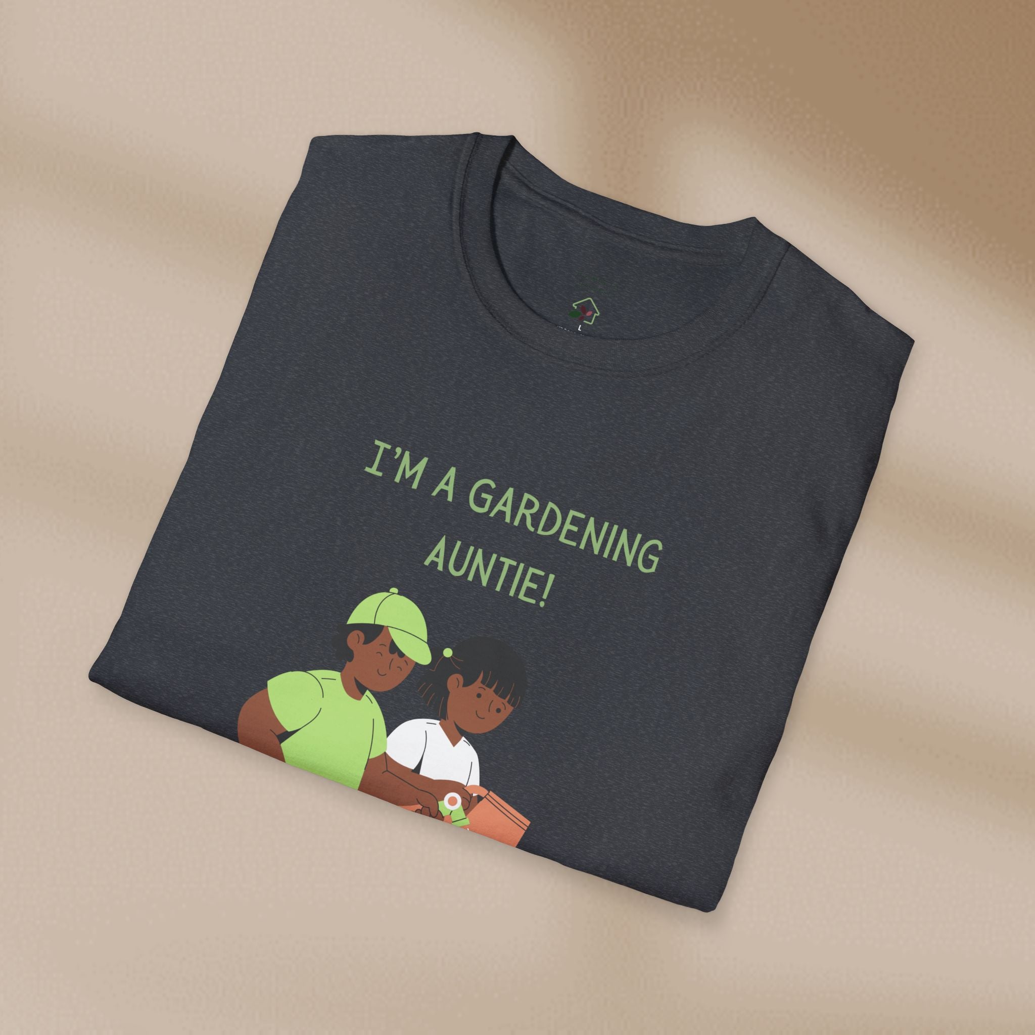 Folded dark gray t-shirt with 'I'm a Gardening Auntie!' text and graphic on a beige background