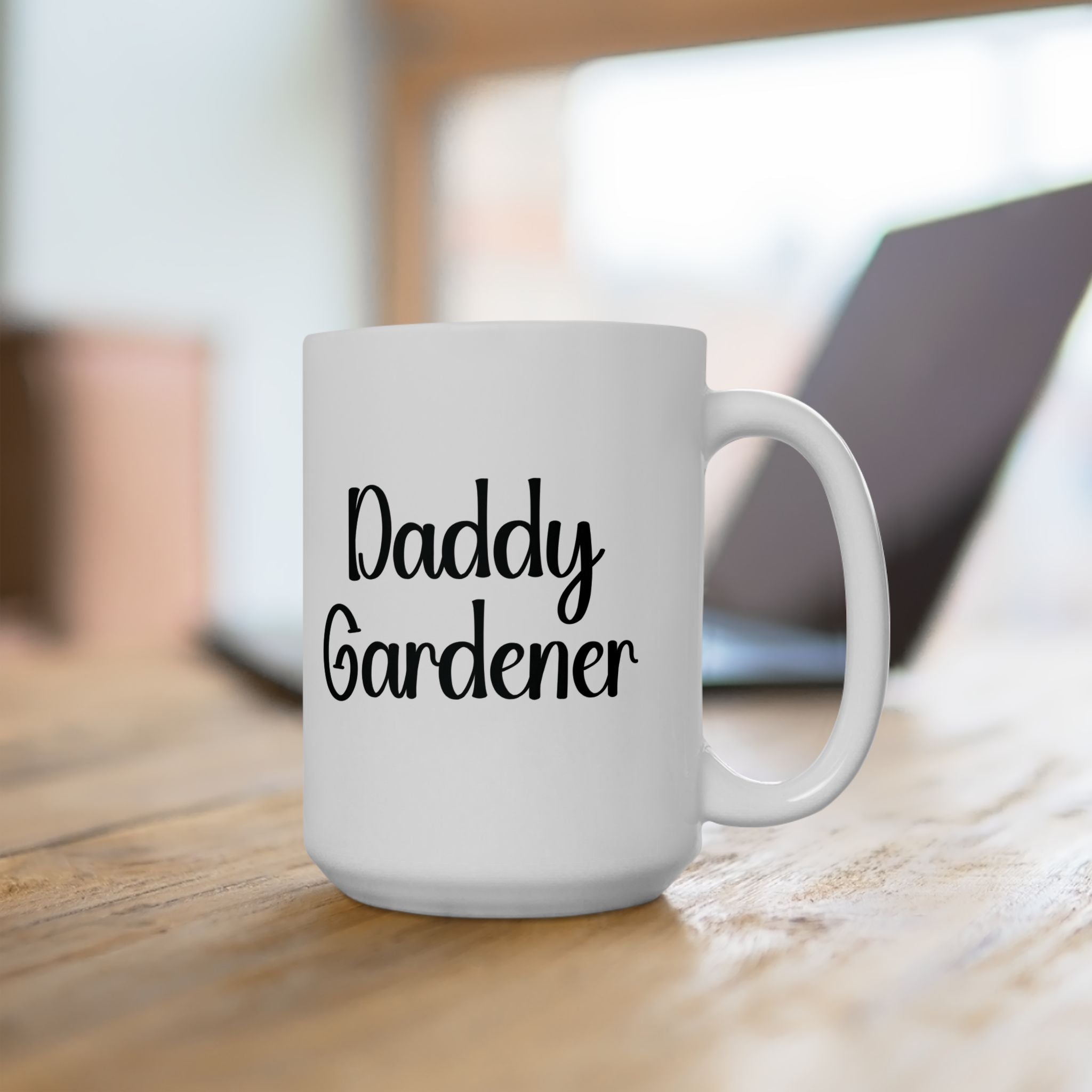 White mug with 'Daddy Gardener' text on a wooden surface
