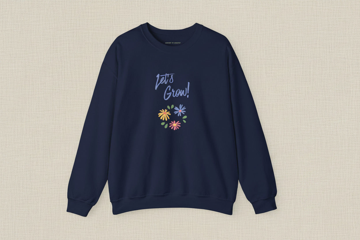 Navy blue sweatshirt with 'Let's Grow!' text and colorful flowers on a white background