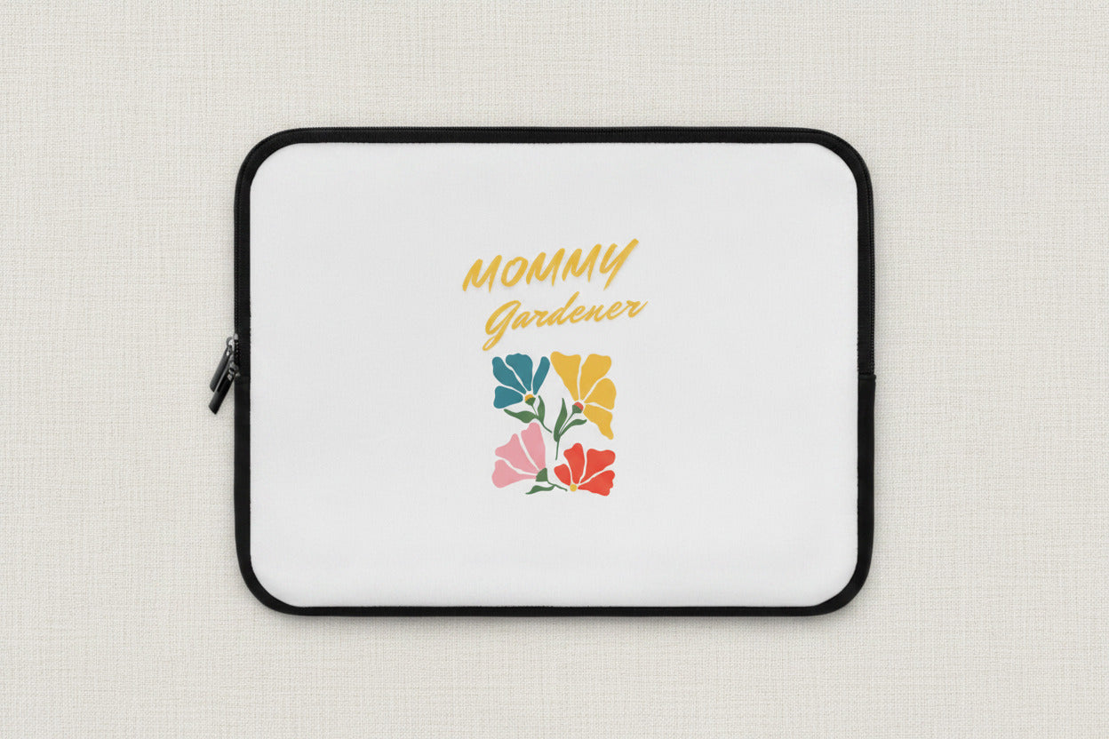 Laptop sleeve with 'Mommy Gardener' text and floral design on a white background
