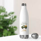 White water bottle with 'Garden Fresh' design on a white surface with greenery in the background