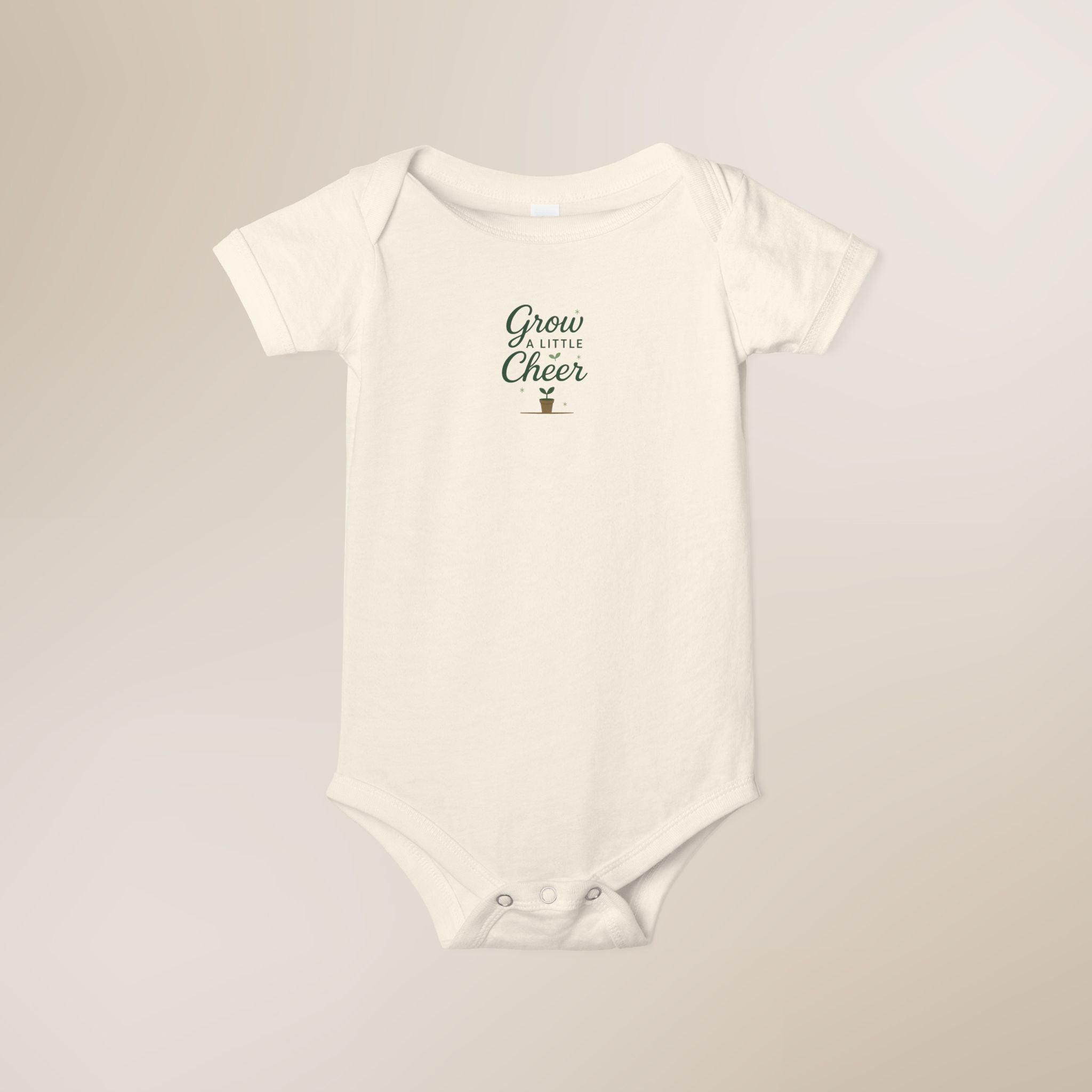 White baby onesie with text on a beige background