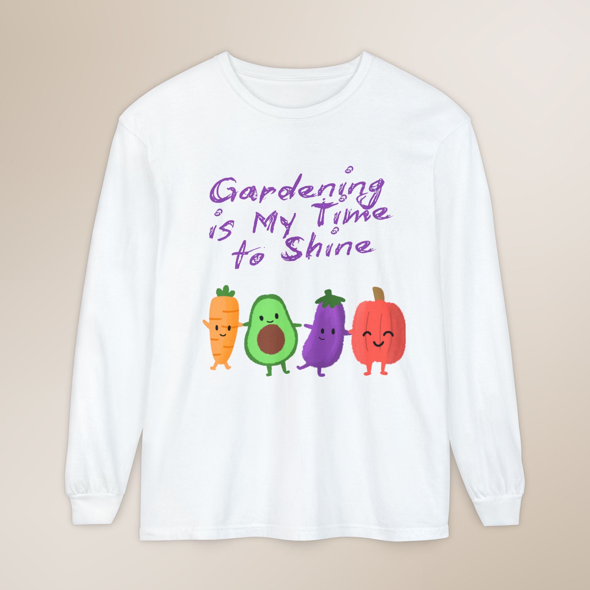 White long-sleeve shirt with cartoon vegetables and text on a beige background