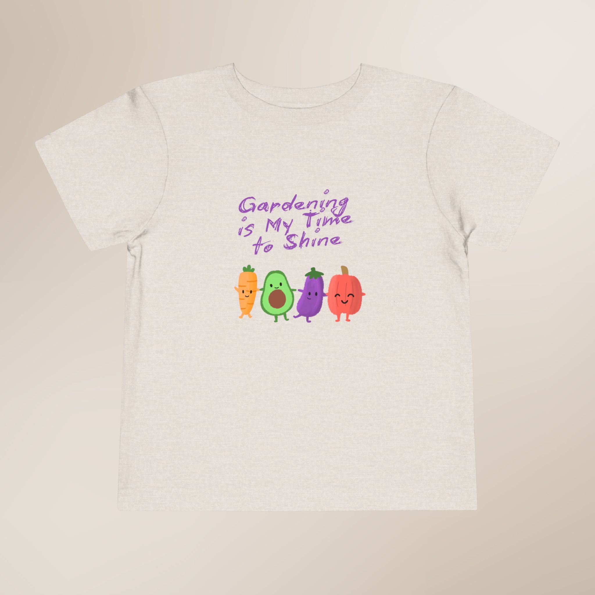 White t-shirt with colorful vegetables and text on a beige background