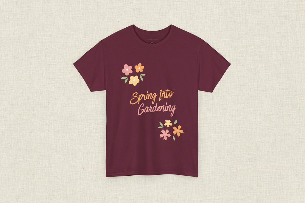 Maroon t-shirt with 'Spring Into Gardening' text and floral designs on a white background