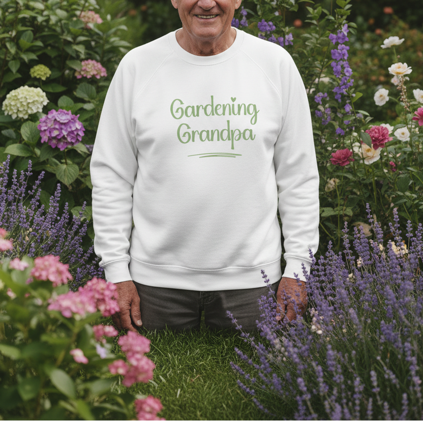 Man wearing a white sweatshirt with 'Gardening Grandpa' text in a garden setting