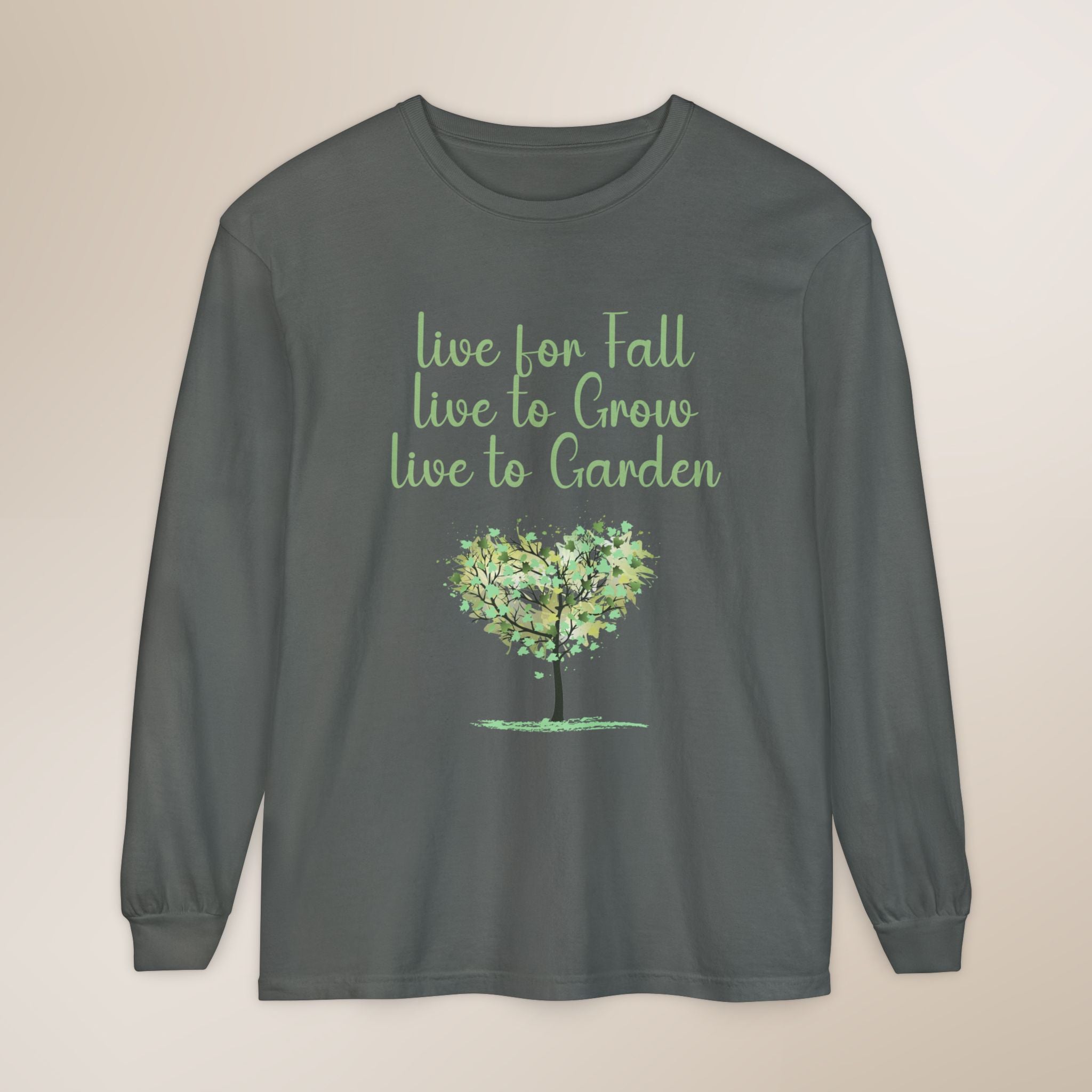 Gray long-sleeve shirt with green tree graphic and text on a beige background