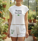 Woman wearing a 'Mommy Gardener' outfit in a greenhouse setting