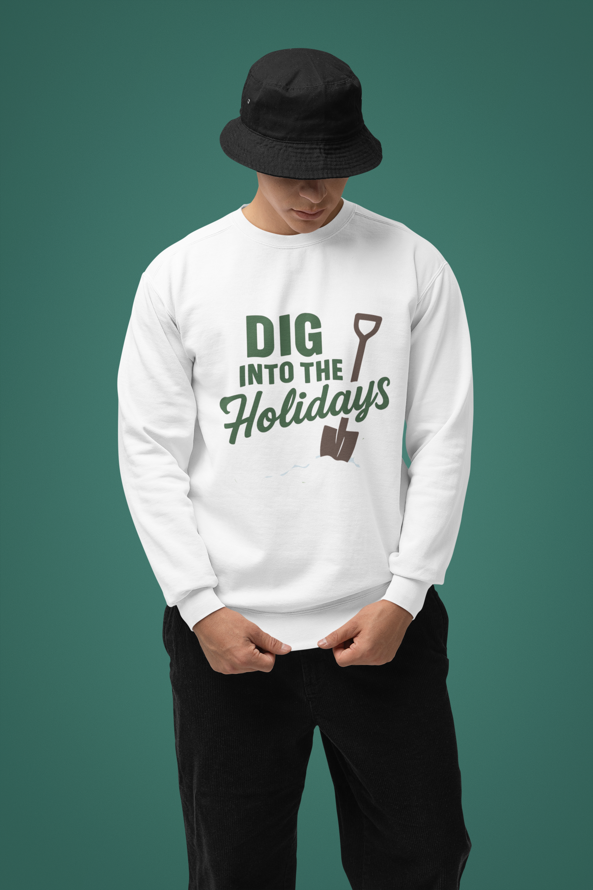 Person wearing a white sweatshirt with 'Dig into the Holidays' text and graphic on a green background