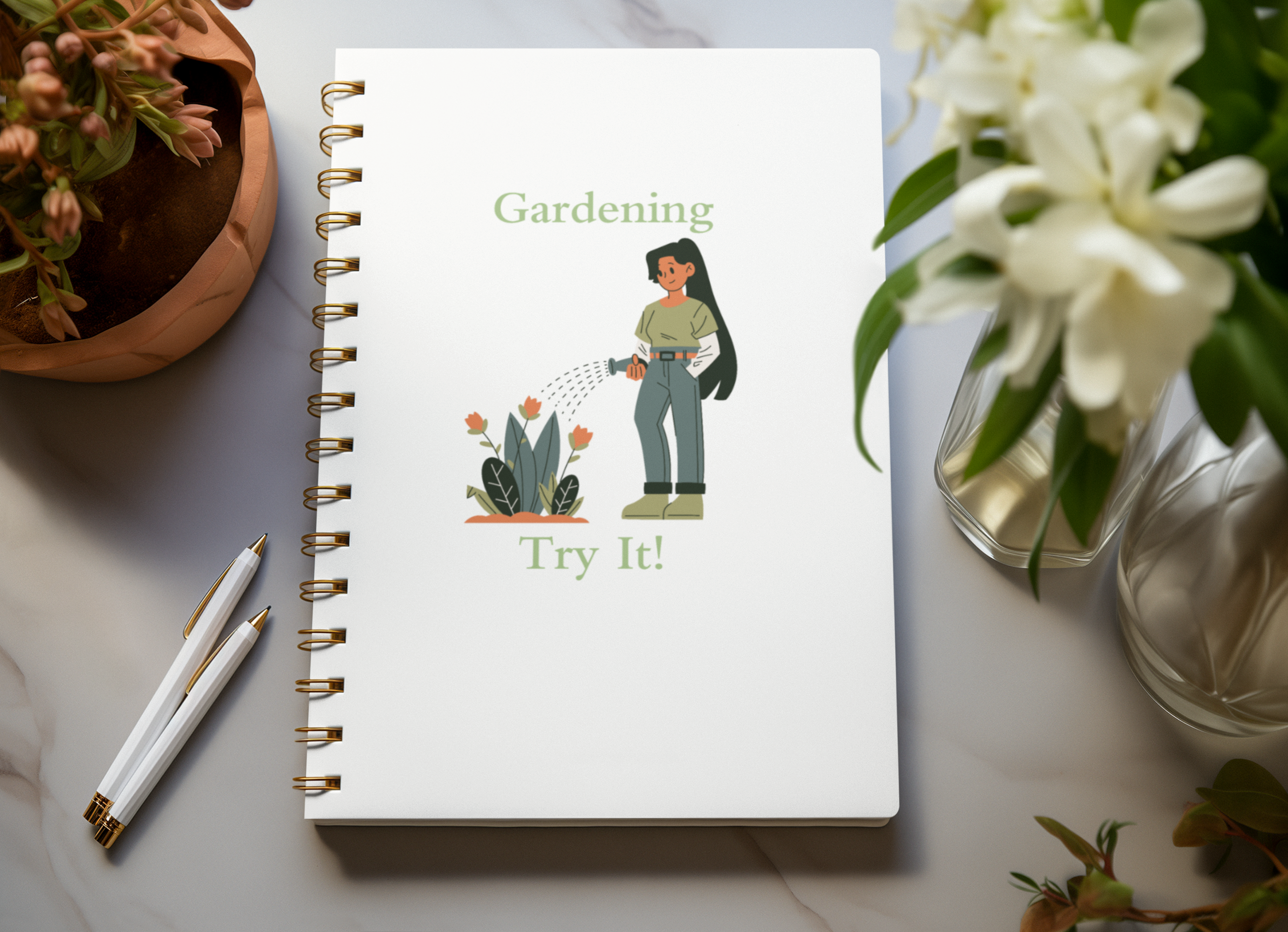 Notebook with gardening illustration and text on a table with plants and pens