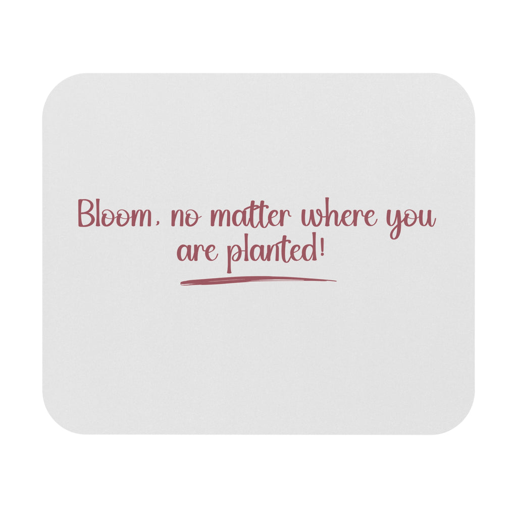 White mouse pad with red text 'Bloom, no matter where you are planted!' on a white background