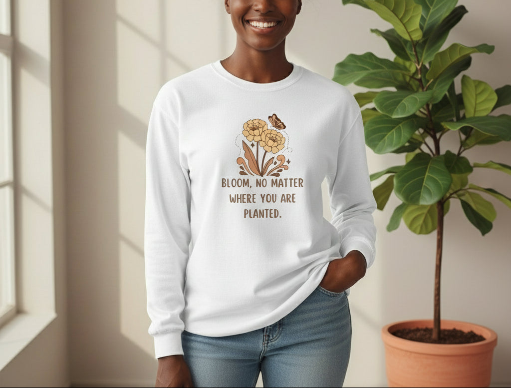 White long-sleeve shirt with floral design and text on a beige background