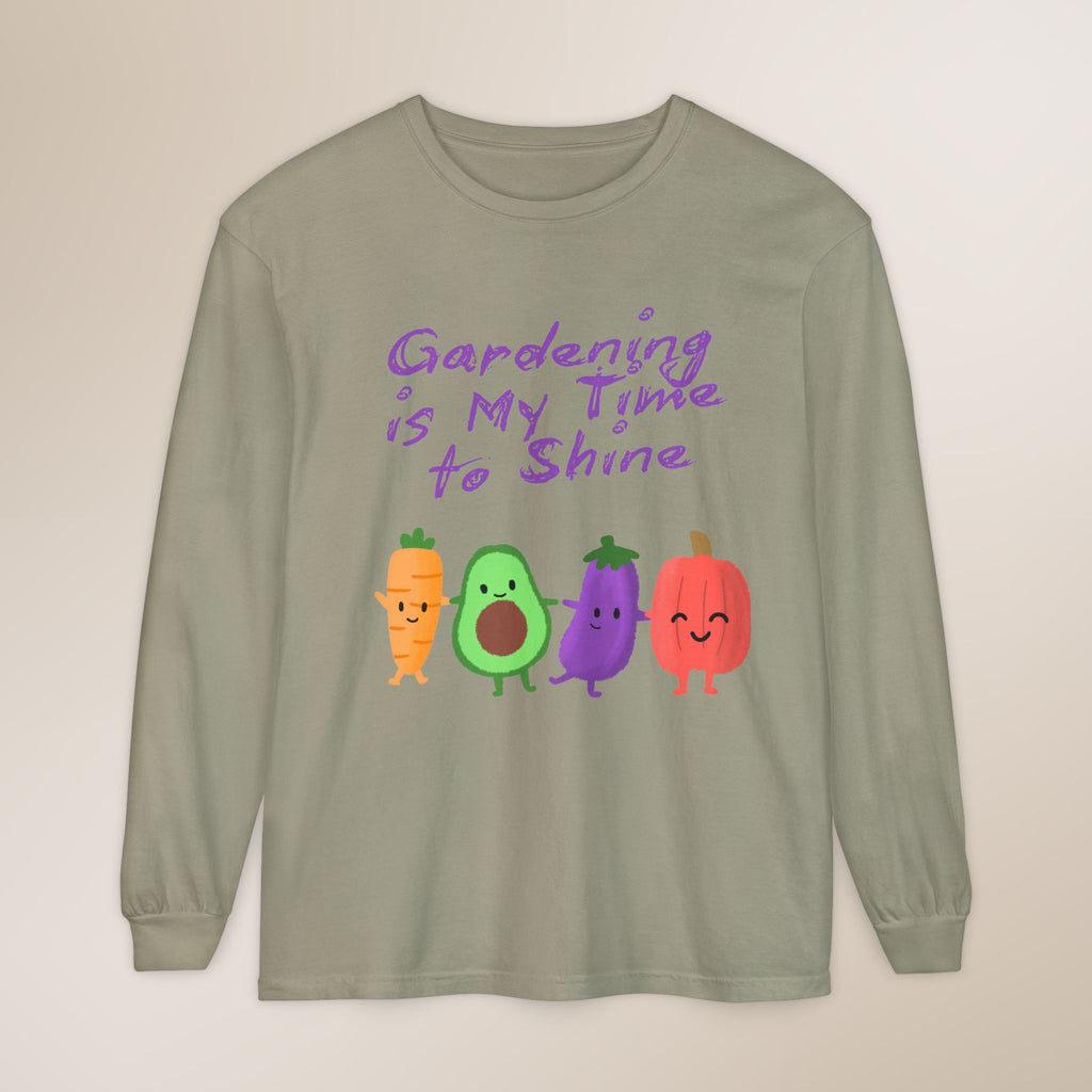 Sage green long-sleeve shirt with cartoon vegetables and text 'Gardening is My Time to Shine' on a beige background