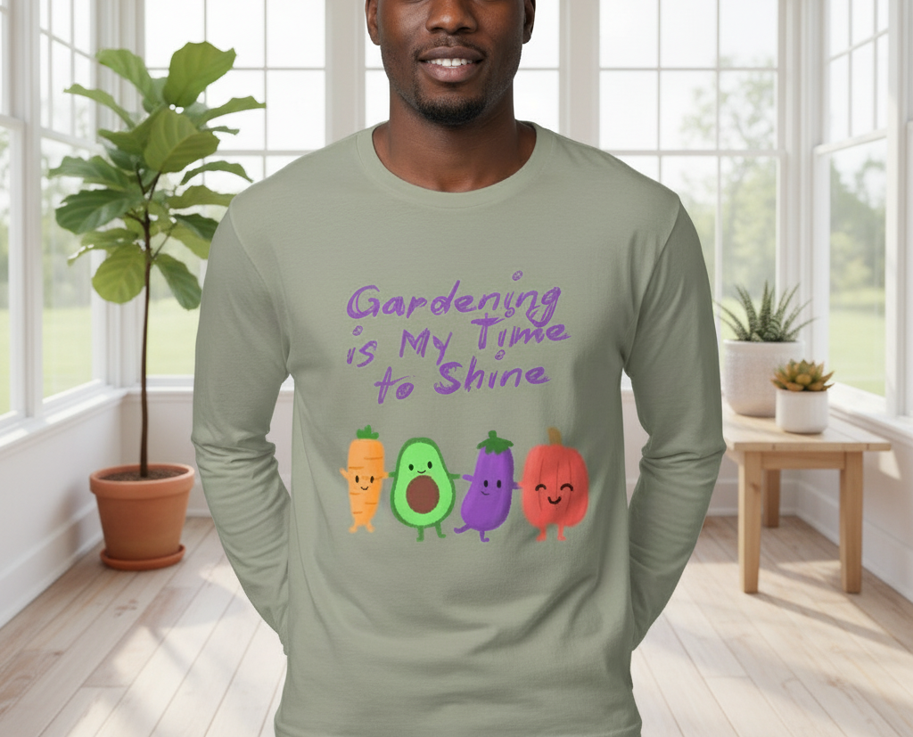 Man wearing a green long-sleeve shirt with vegetable graphics and text in a bright room.