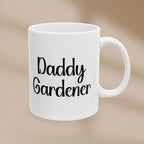 White mug with 'Daddy Gardener' text on a beige background