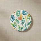Round coaster with leaf pattern on a white background