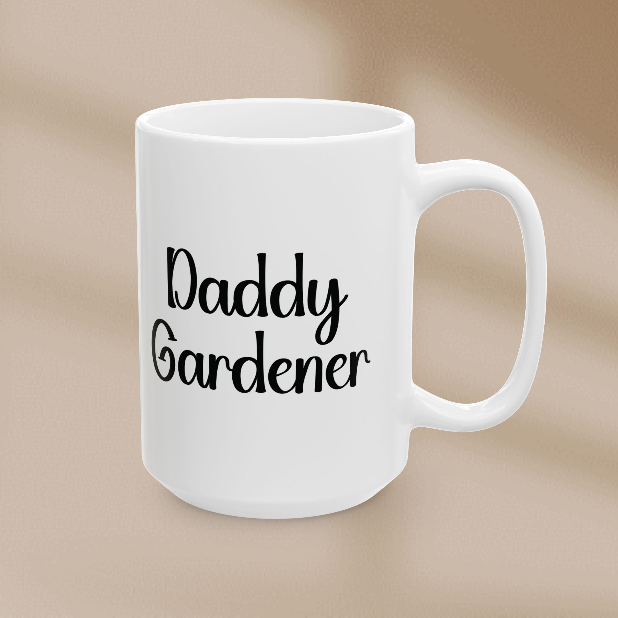 White mug with 'Daddy Gardener' text on a beige background