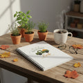 Notebook with 'Garden Fresh' design featuring a truck and leaves on a white background