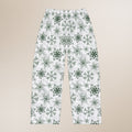 Pajama pants with green snowflake pattern on a beige background