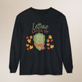 Black long-sleeve shirt with a cartoon lettuce character and 'Lettuce Layer Up' text on a beige background