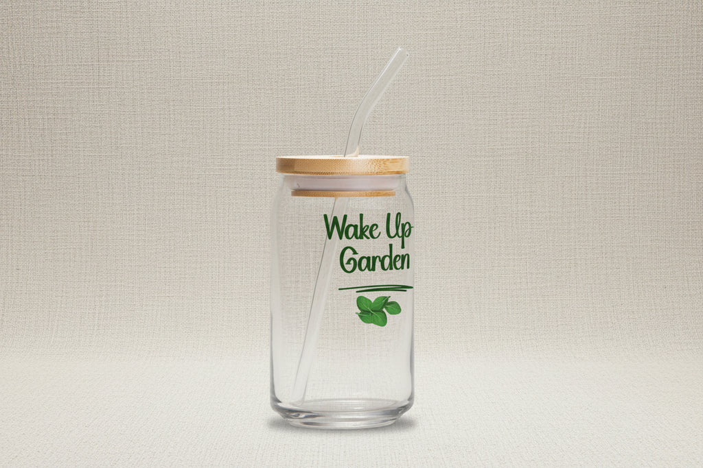Clear glass tumbler with bamboo lid and straw, featuring 'Wake Up Garden' text and leaf design on a white background.