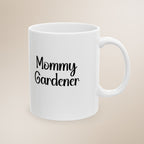 White mug with 'Mommy Gardener' text on a beige background