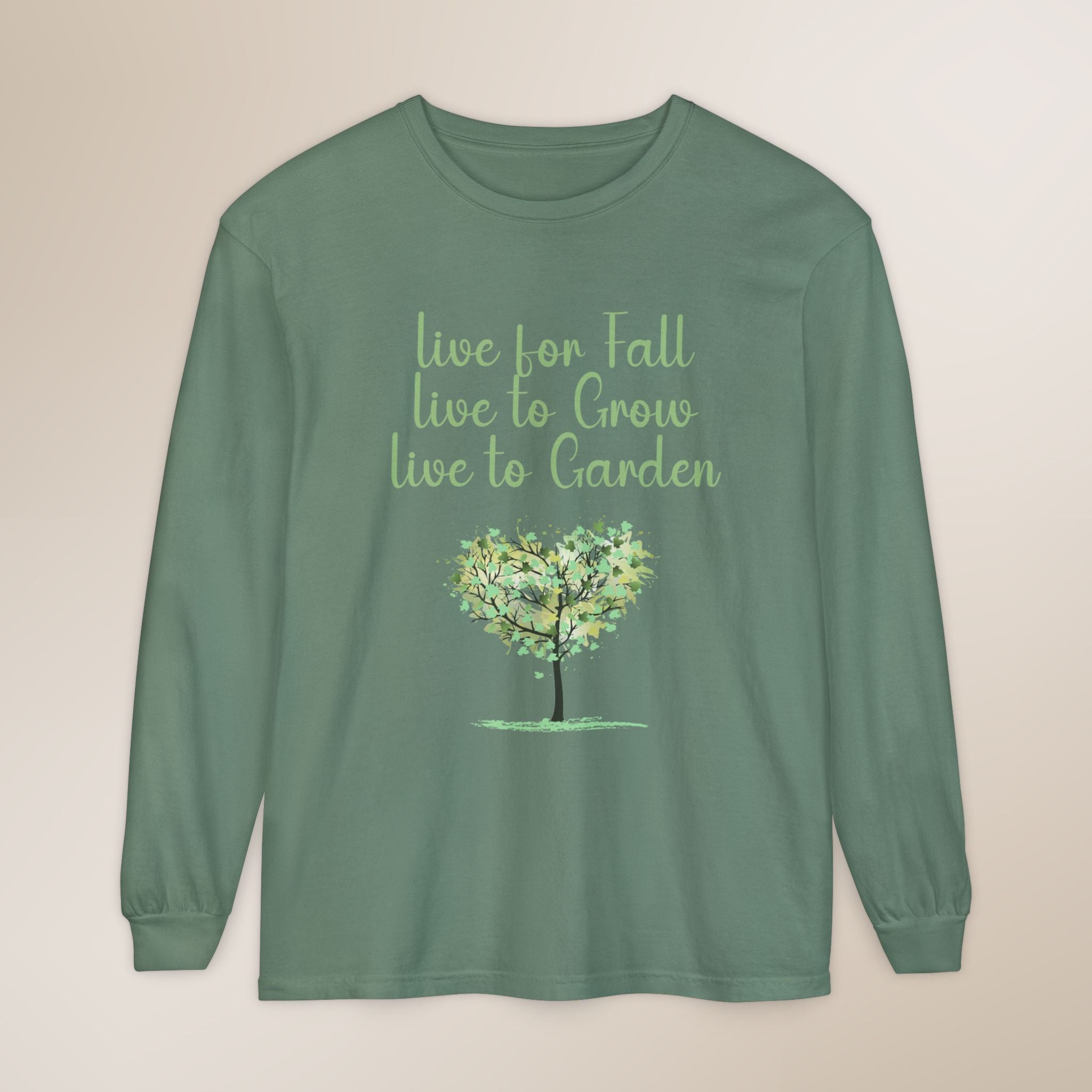 Green long-sleeve shirt with a tree graphic and text on a beige background