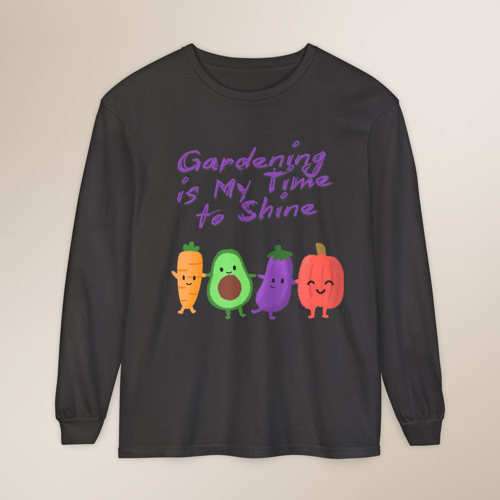 Black long-sleeve shirt with colorful vegetable graphics and text on a beige background