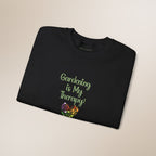 Folded black t-shirt with 'Gardening is My Therapy!' text and floral design on a beige background