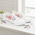 White sneakers with floral designs on a white surface