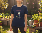 Person wearing a navy blue t-shirt with gardening graphic and text in a garden setting