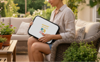 Woman holding a white tray with floral design in a garden setting
