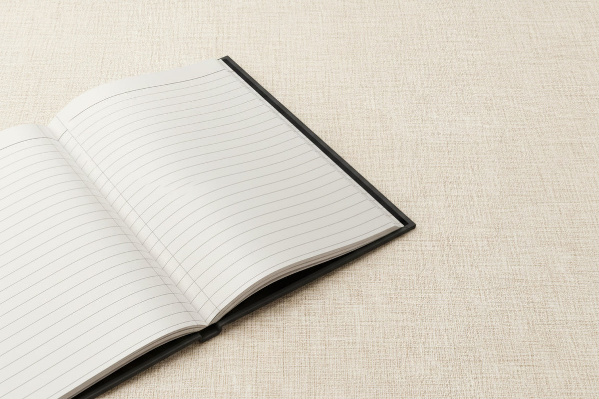 Open notebook with lined pages on a white background