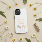 Phone case with floral design and text on a beige background with flowers and leaves.