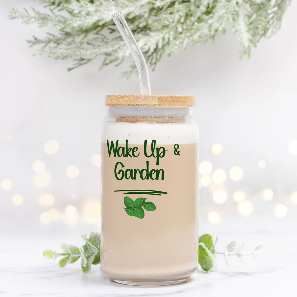 Glass jar with straw and 'Wake Up & Garden' text on a light background