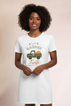 White t-shirt with a graphic of a green truck and 'Garden Fresh' text on a beige background