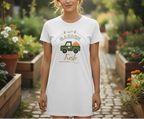 Woman wearing a white t-shirt with a garden-themed design in a garden setting