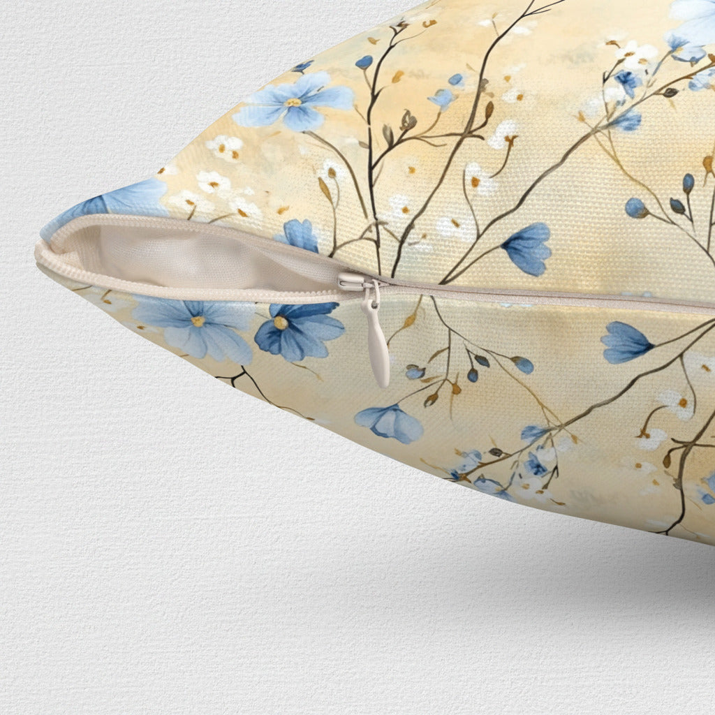 Floral-patterned pillow with blue flowers on a beige background