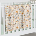 Floral patterned curtain hanging on a white window frame